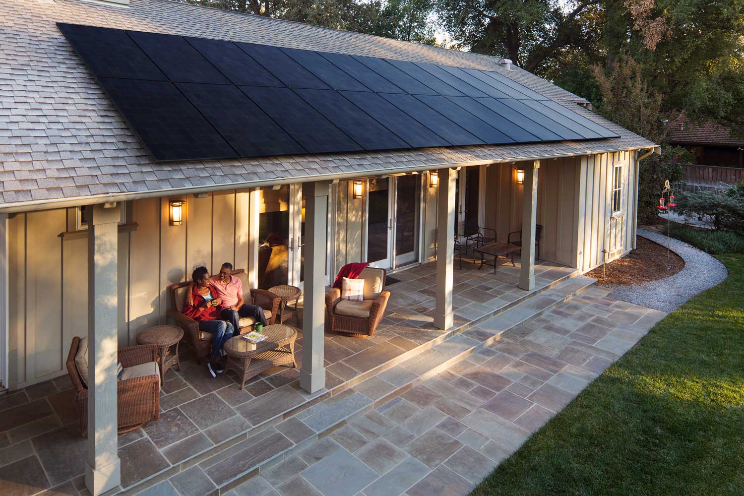 This lovely back patio also features solar panels with SunPower by Custom Energy.